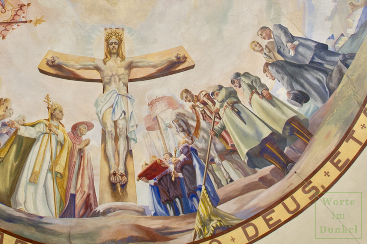 Der Ausschnitt aus dem Fresko zeigt den gekreuzigten Jesus Christus mit einer goldenen Krone. Neben ihm stehen Kaiser Karl I. zu Pferde, Soldaten, Dollfuß, Fey und Starhemberg